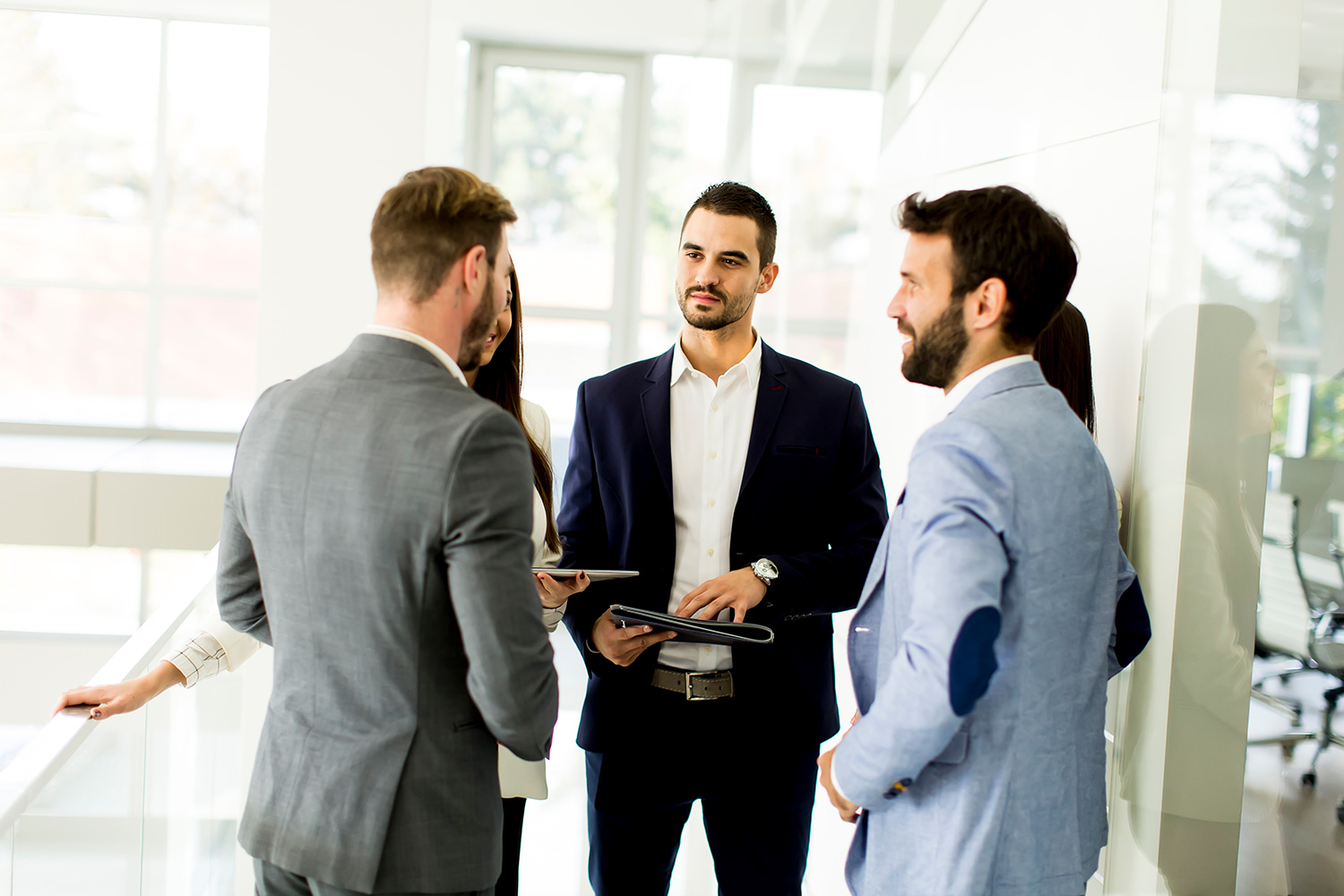 Colleagues networking in an office, showing the workplace of the biggest companies in Utah.