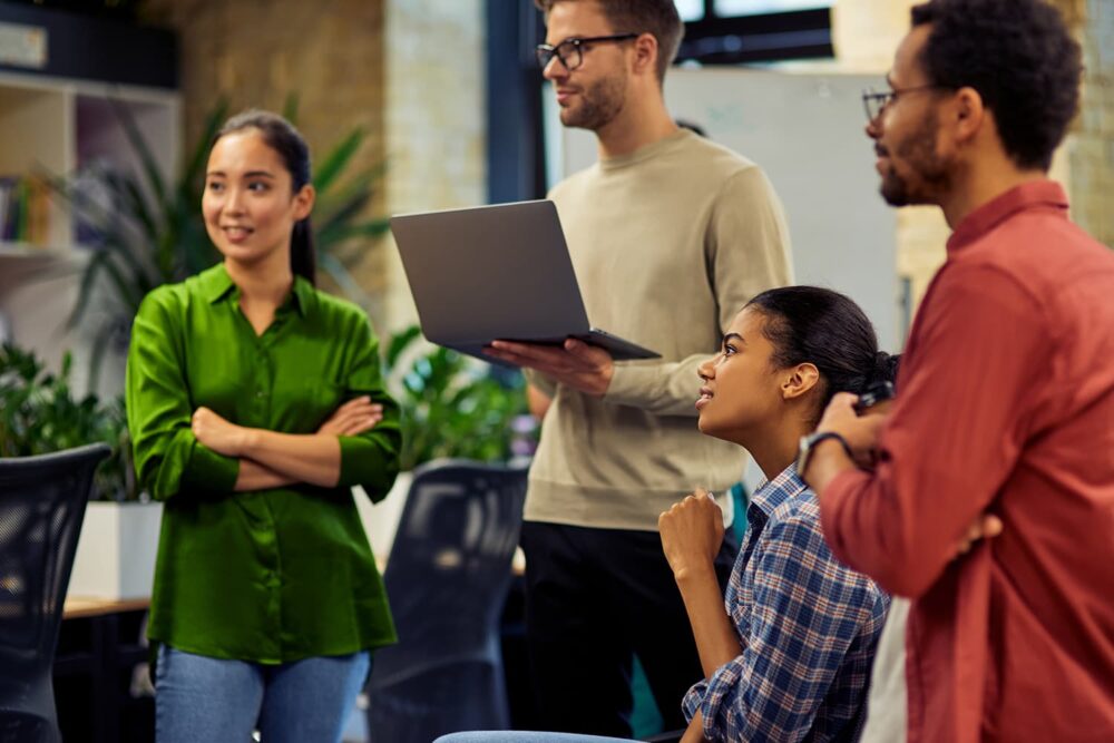 A young diverse team participating in an onboarding session. Essential for maintaining compliance with child labor regulations.