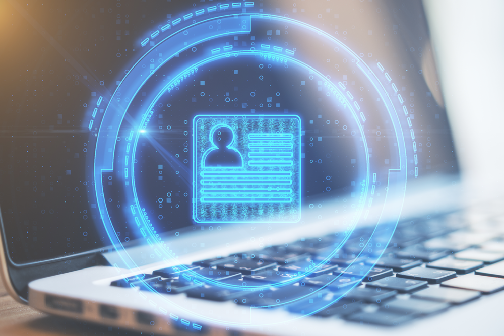 Laptop displaying a glowing digital ID profile icon, representing AI recruitment software used for candidate identity verification