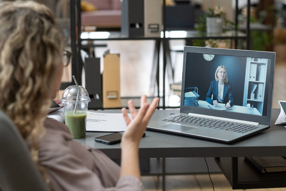 Job candidate speaking with a hiring manager during a video interview, illustrating how AI in talent acquisition supports remote hiring